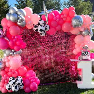 pink shimmer wall and number 1 table